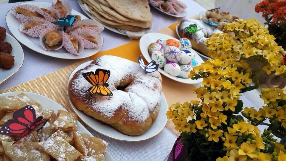Ka'ak rings decorated with confectioner's sugar, decorated eggs and other traditional sweets and pastries enjoyed in the spring